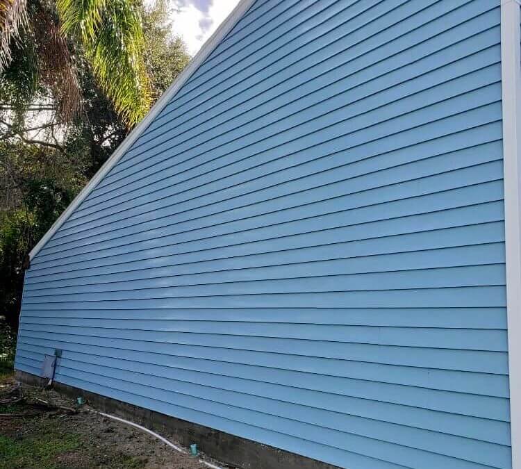 Blue siding after being pressure washed