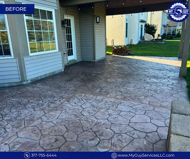 Freshly cleaned and sealed concrete driveway in an Avon subdivision